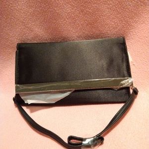 Black shiny seel handbag over the shoulder strap